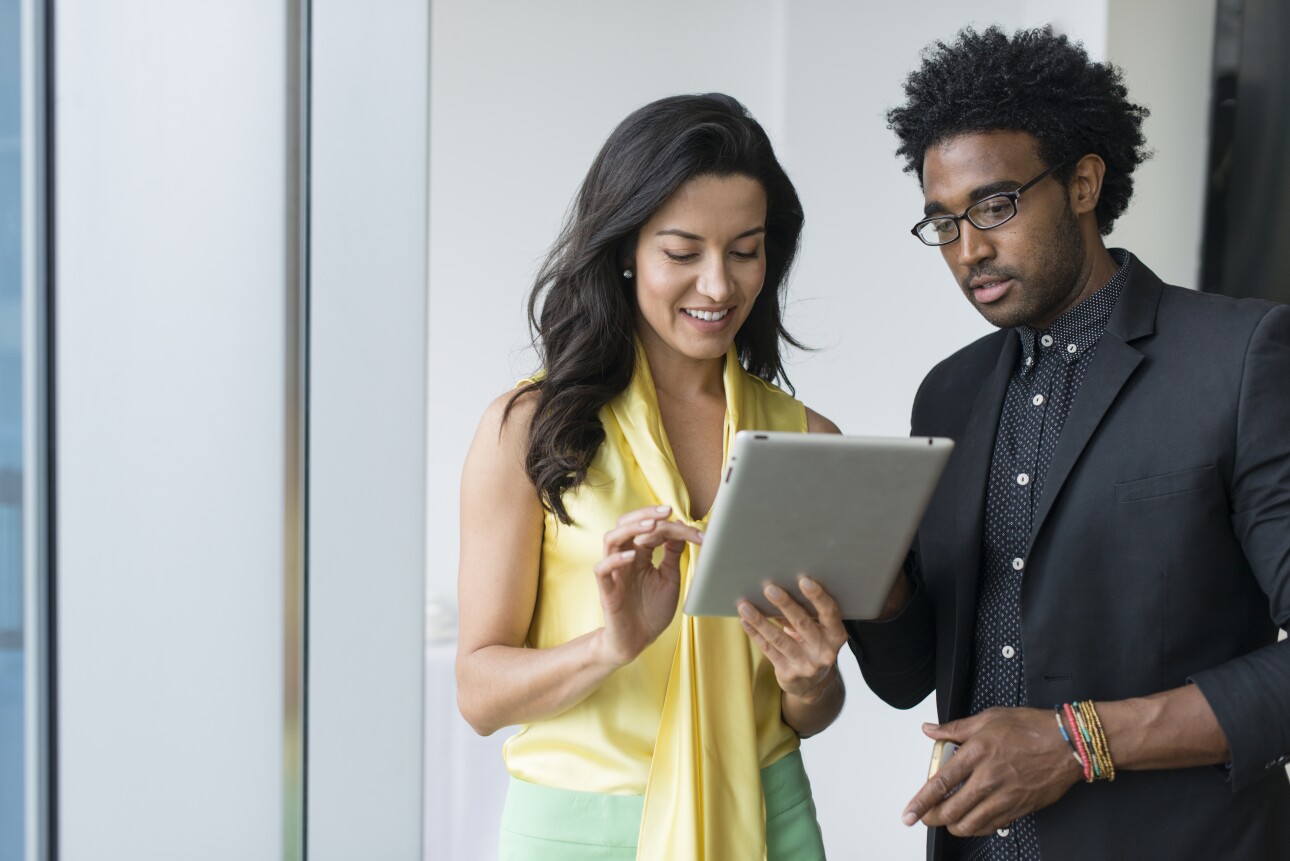 business people using digital tablet in office