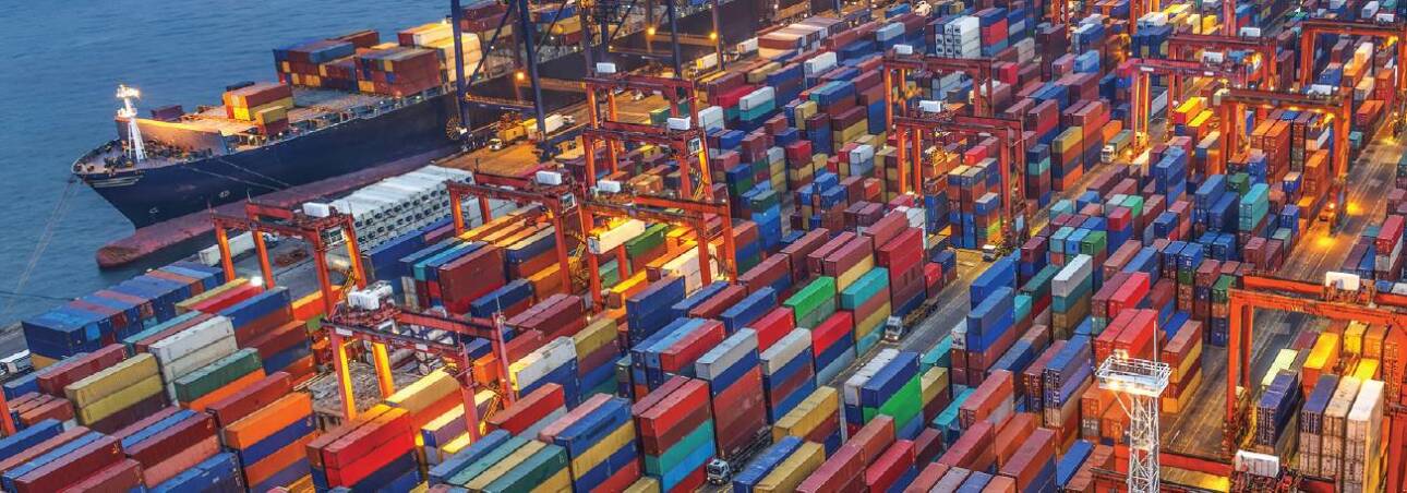 shipping dock packed with colorful shipping containers