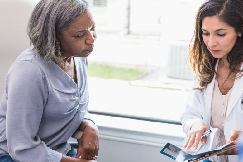doctor explaining instructions to her patient