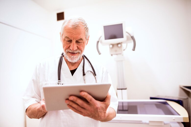 doctor reviewing patient imaging results in a tablet