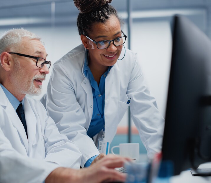 doctors looking at monitor