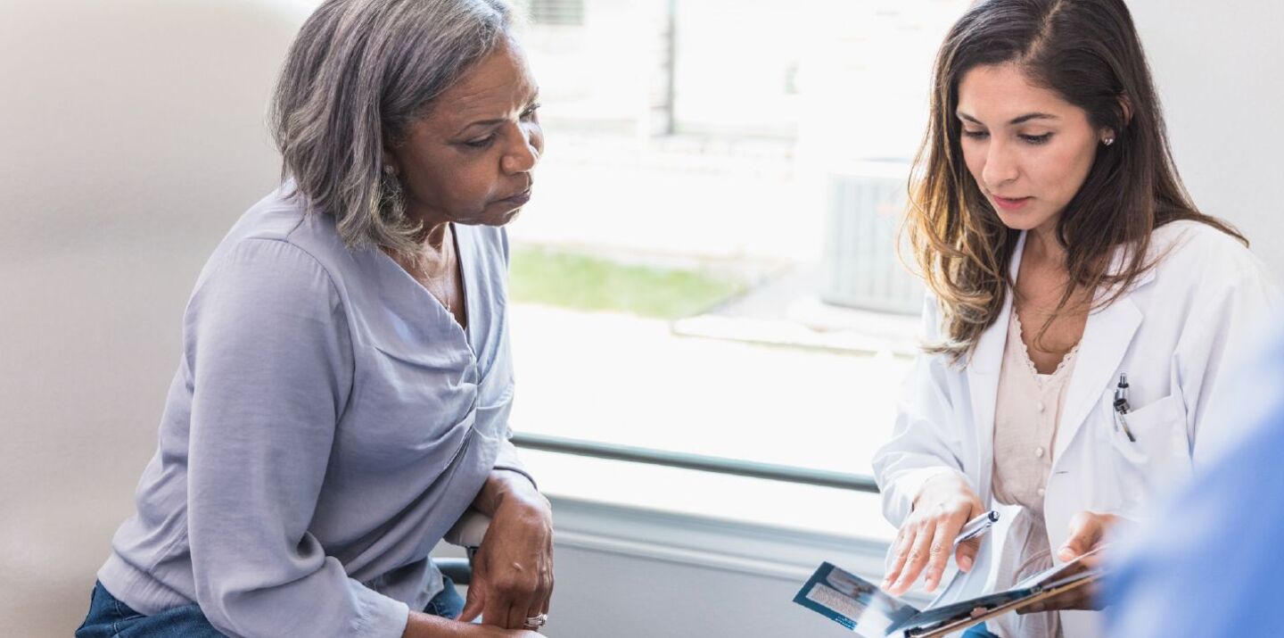 doctor explaining instructions to her patient