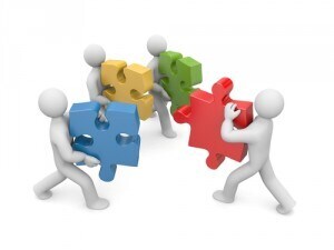 illustration of four personas carrying puzzle pieces