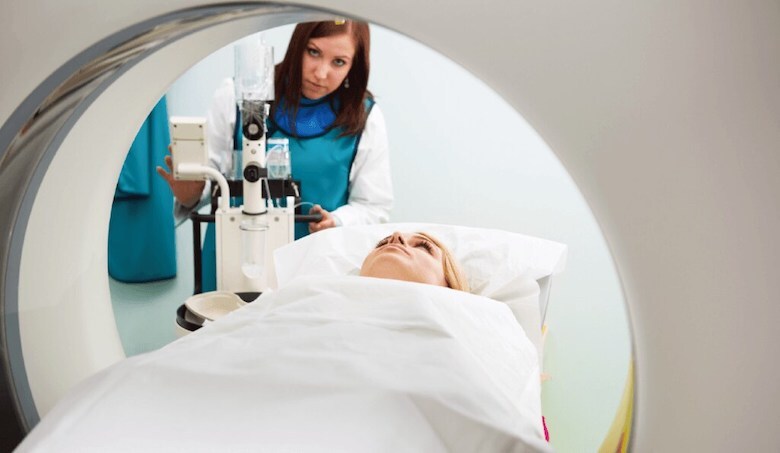 medical technician taking an MRI of a patient