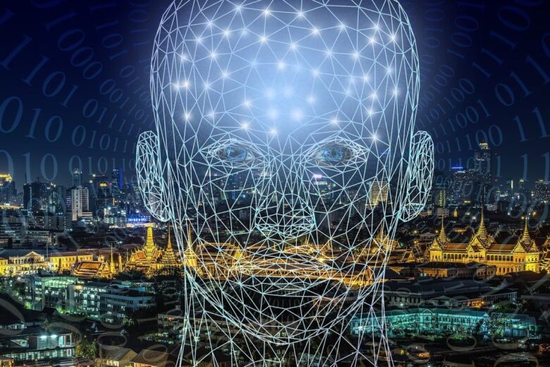 outline of human head overlaid on city background