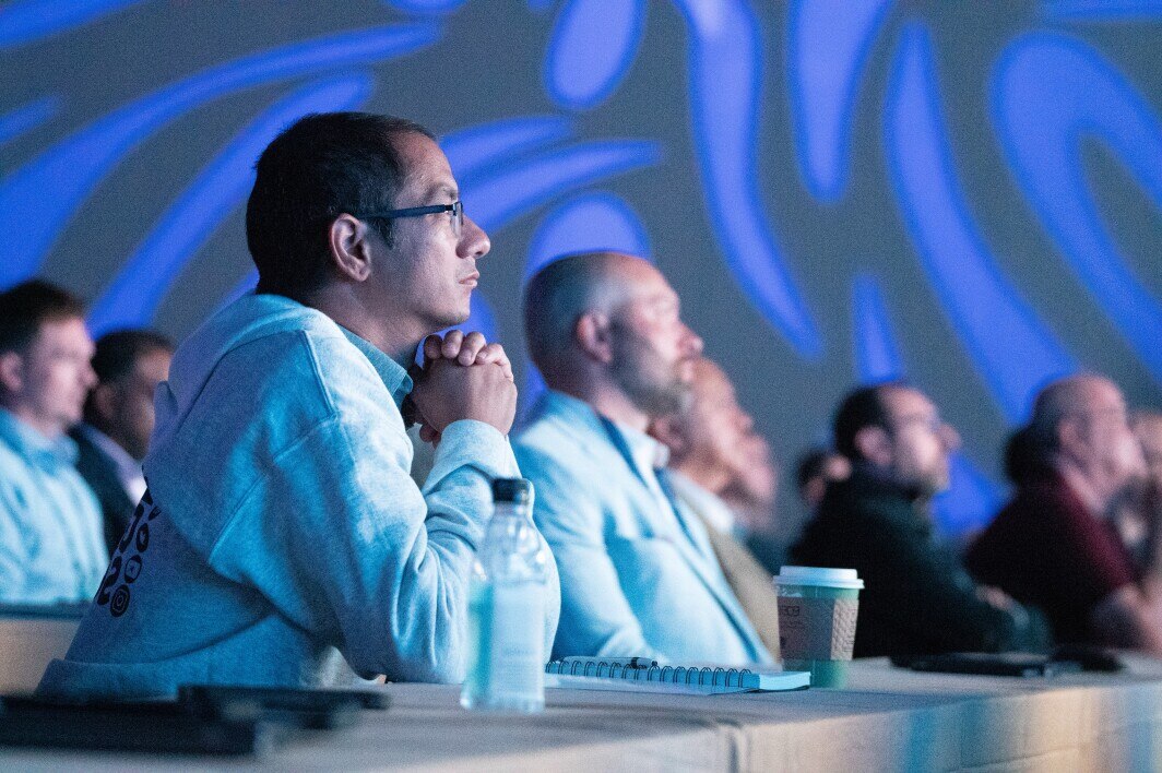 global summit audience watching key notes
