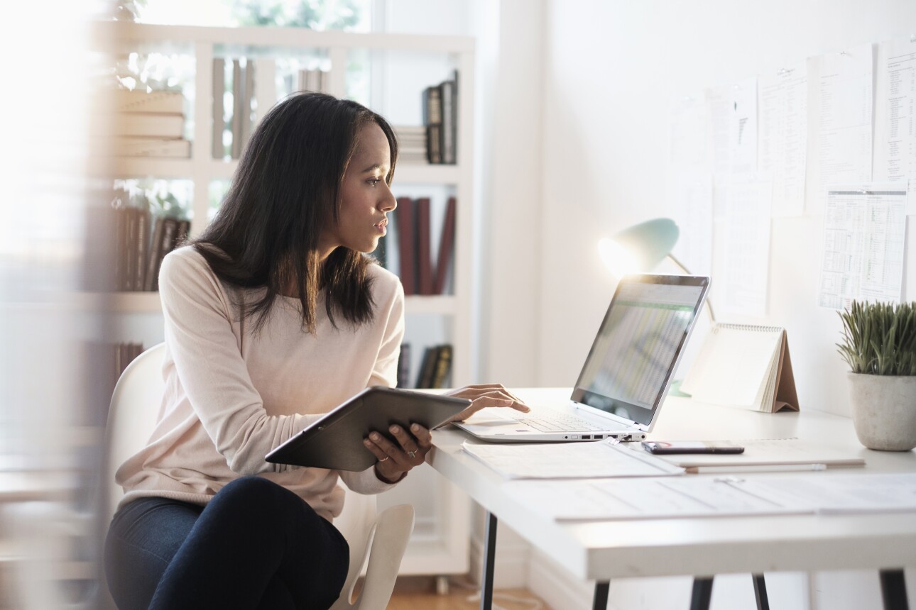 business woman working on laptop in her home office