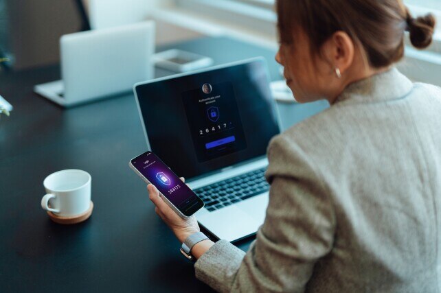 Business woman authenticating her banking login