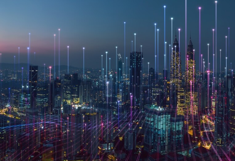 city skyline at night with lights glowing