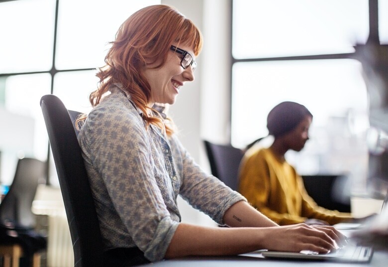  woman working at her desk in an office