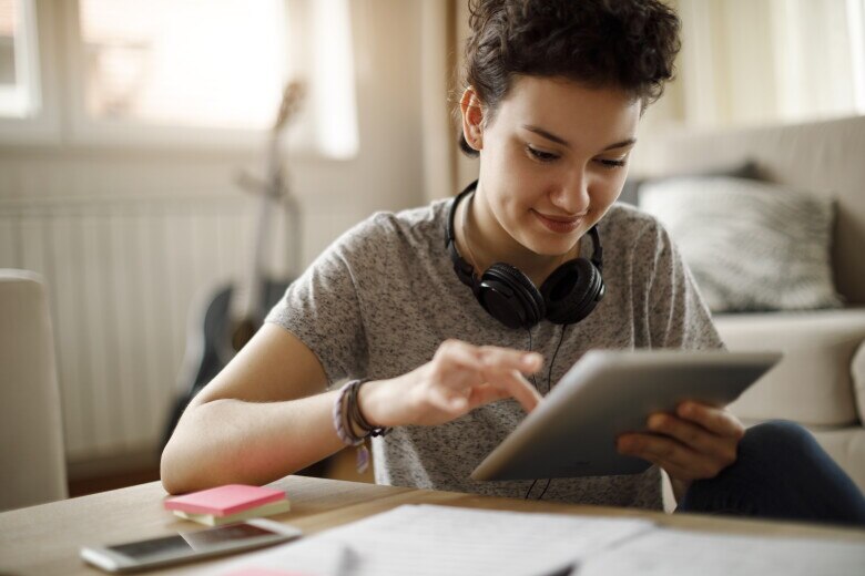 young student at home on tablet