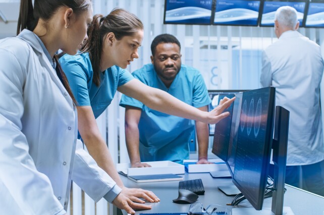 group of doctors looking at images