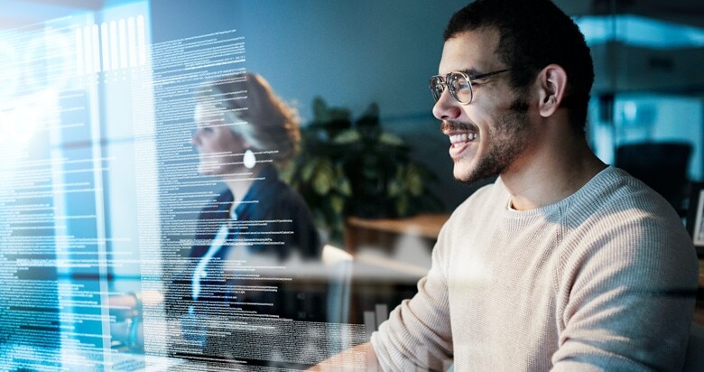 programmers reviewing code on their computers in the office