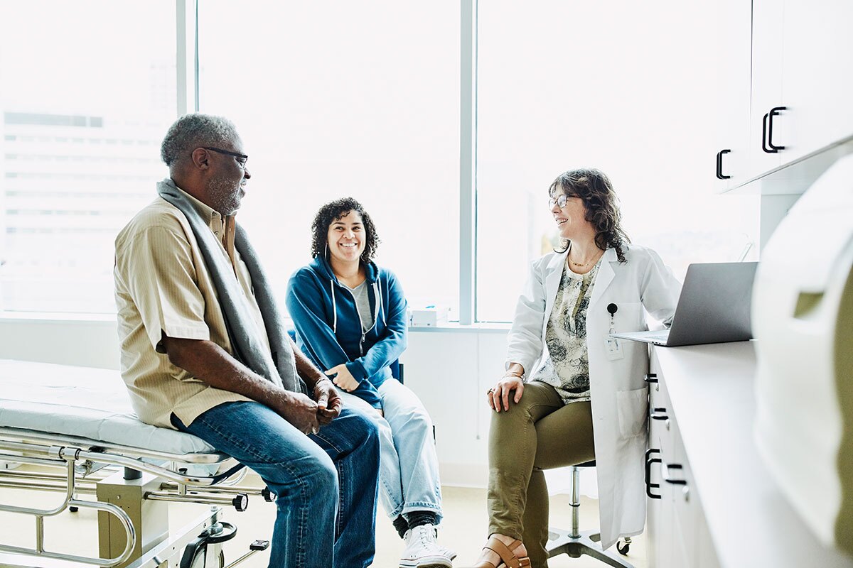 doctor speaking with patient in an exam room