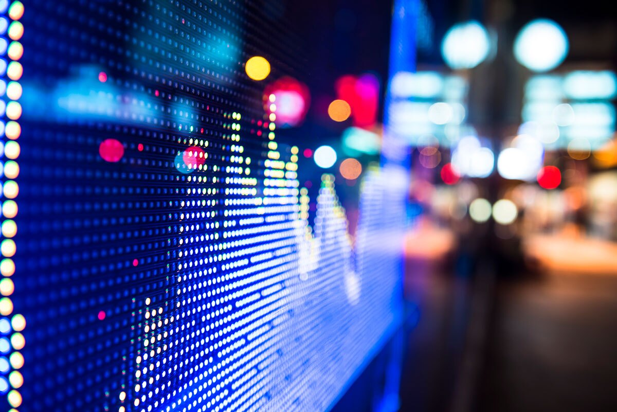 bright lights of a screen showing data in a graph