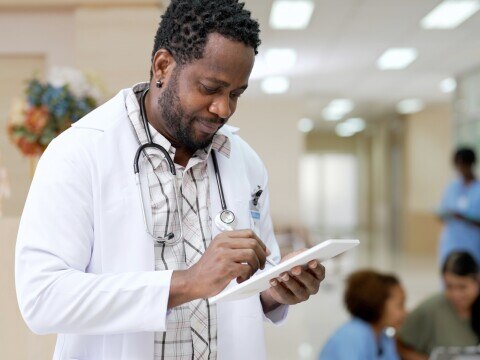 doctor with tablet