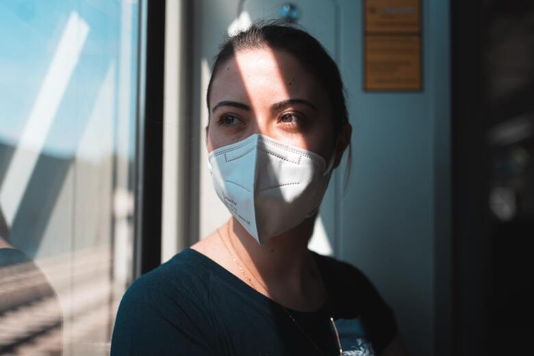 Masked Nurse at Window