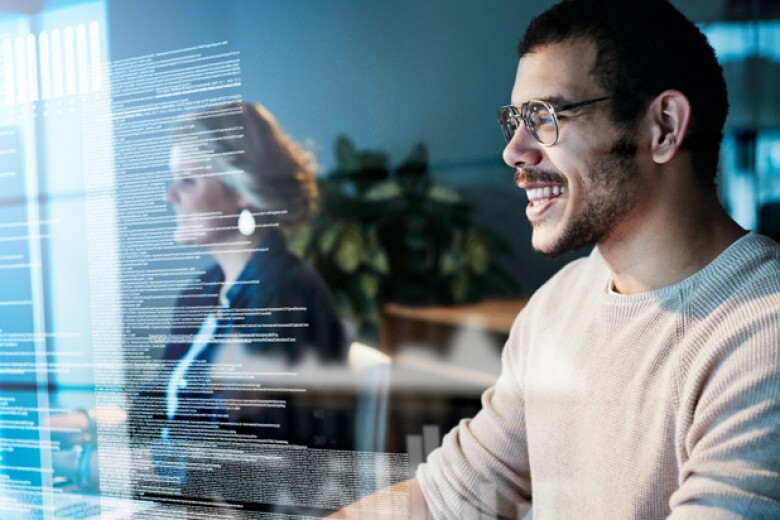 programmers reviewing code on their computers in the office