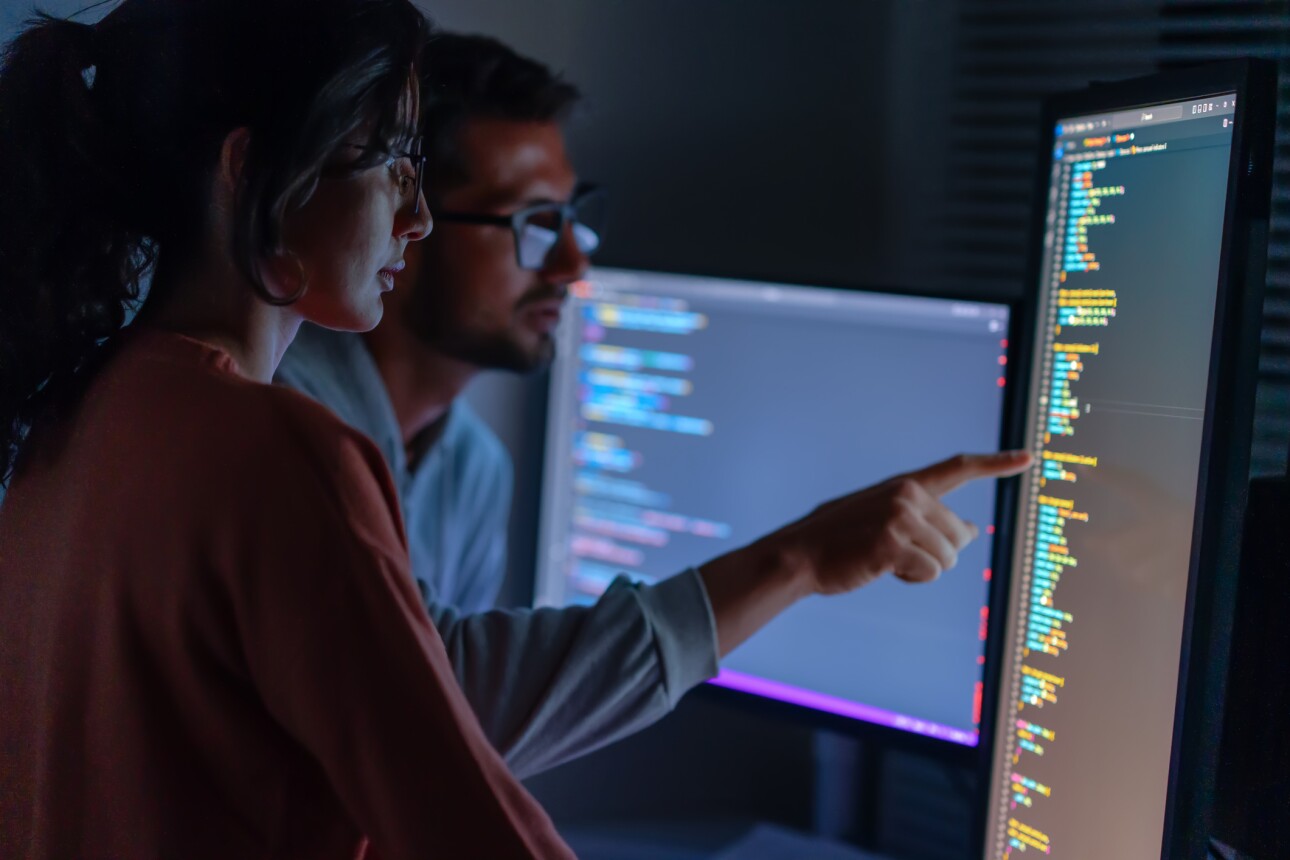 Female IT specialist, male coder talking to connect internet, information update and cloud computing