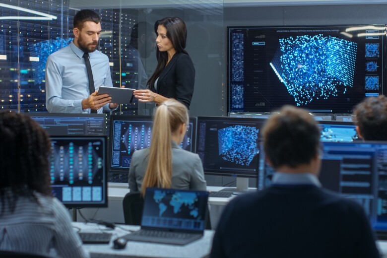 group of colleagues analyzing data in real-time