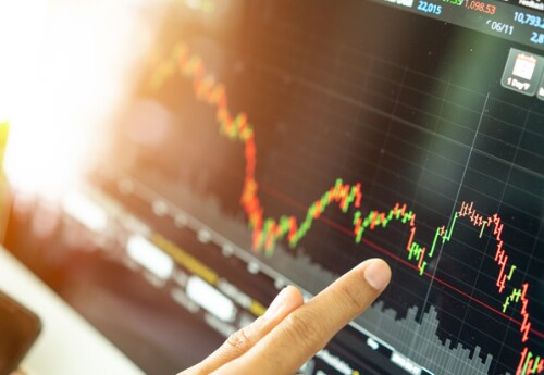 financial services professional analyzing a graph of financial data