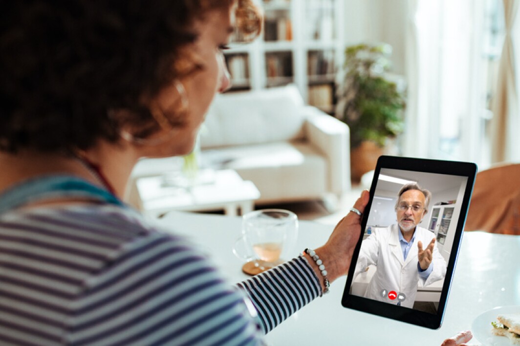 patient using tablet for a virtual doctor visit