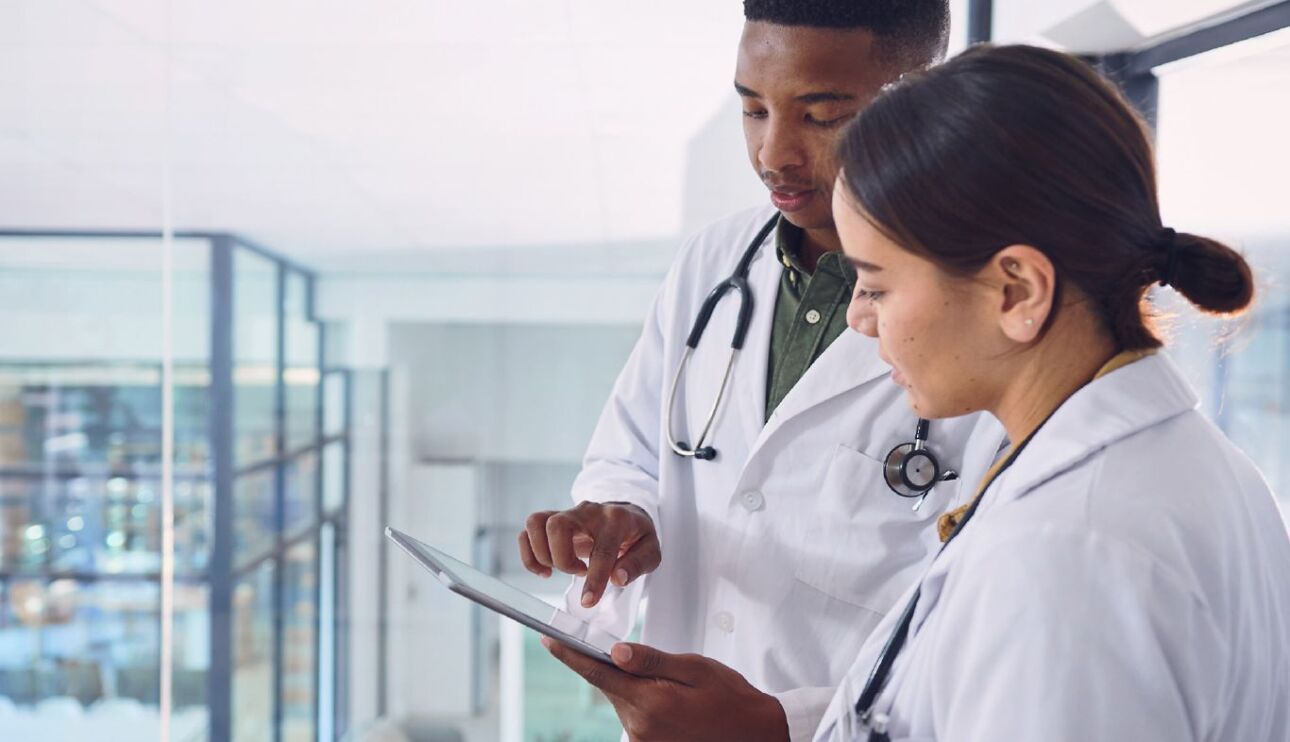 Doctors looking at an ipad