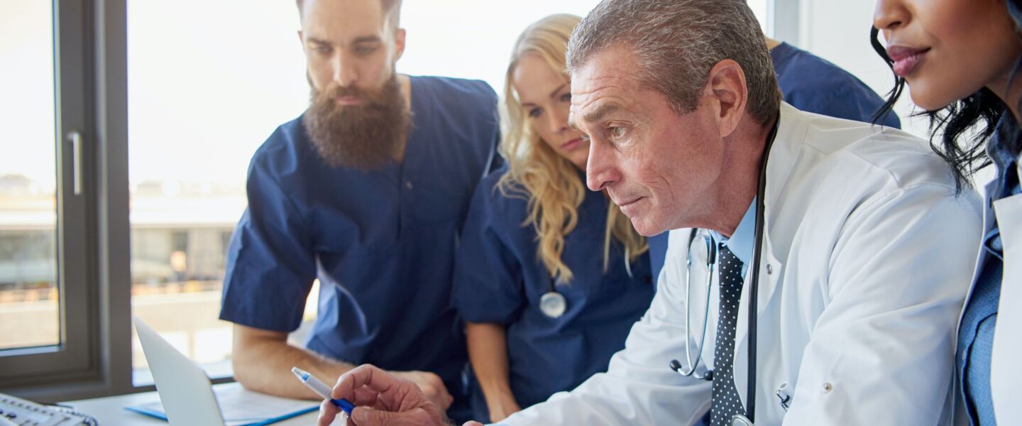 doctors working on a laptop