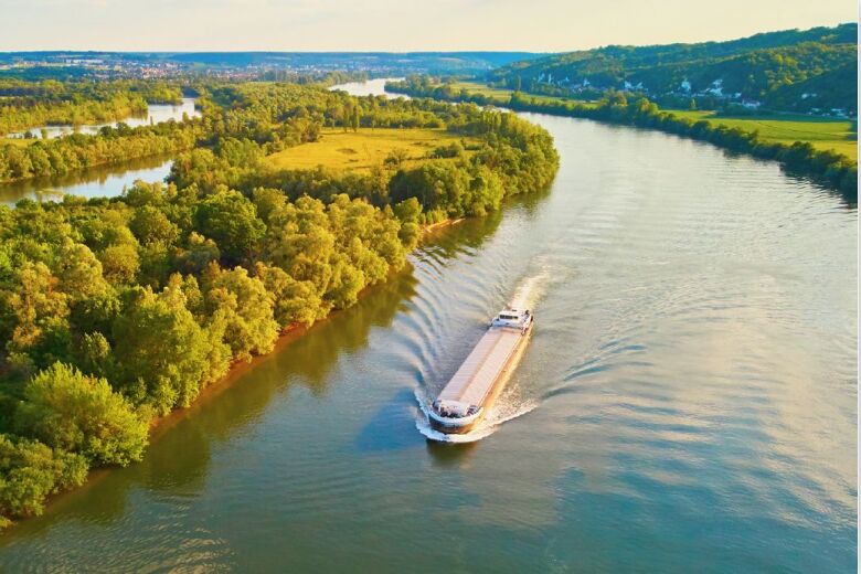 boat cruising down a river