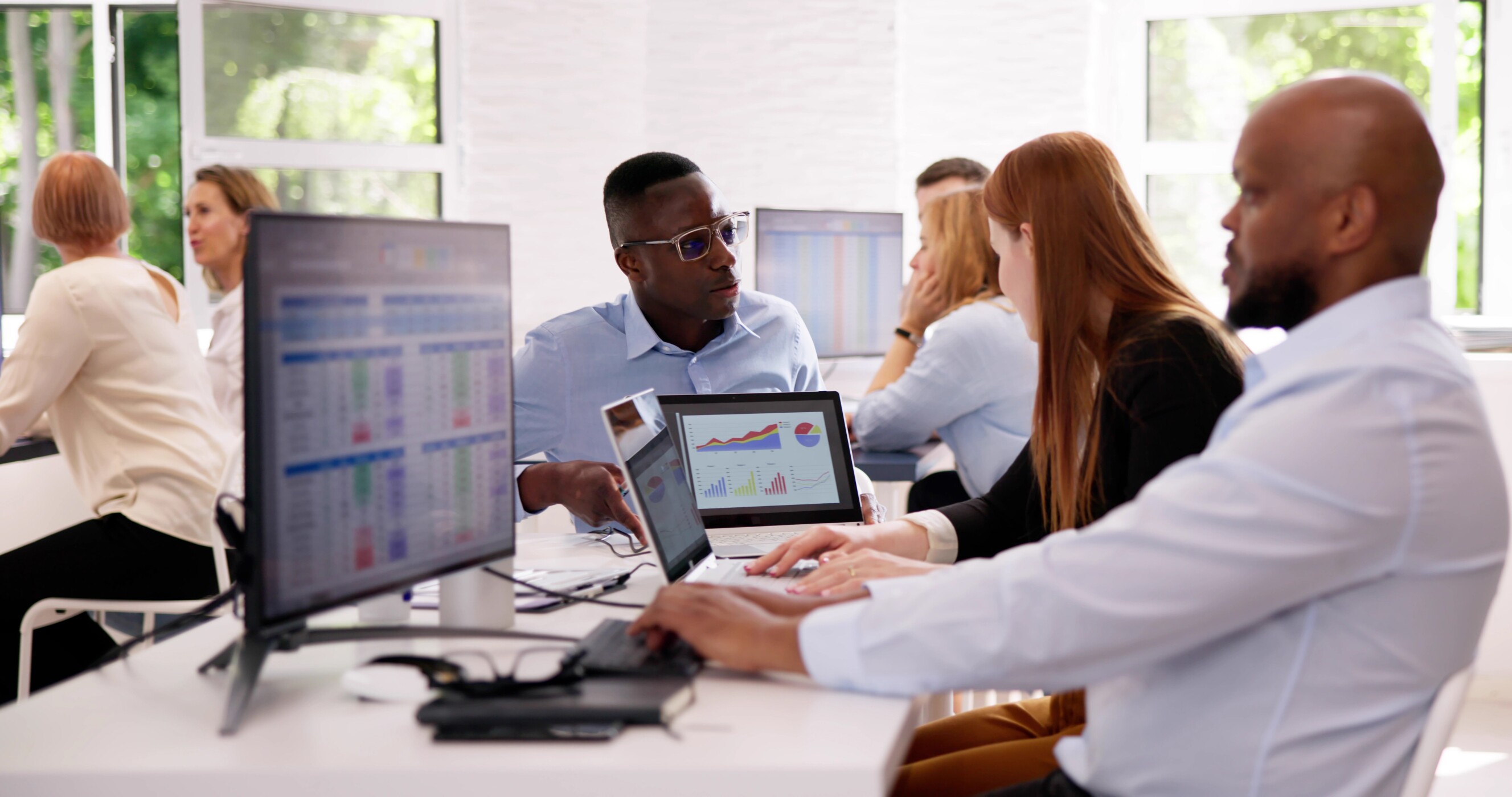 Analyst Working With Spreadsheet Business Data On Computer