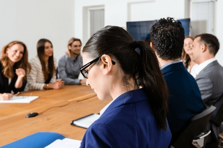 business professionals around a table in a conference room