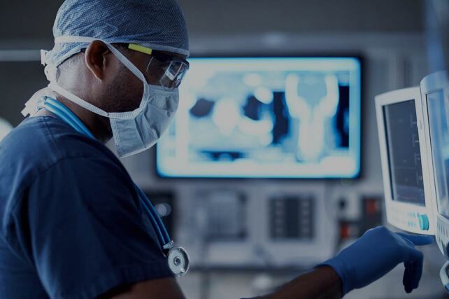 medical professional setting up monitors