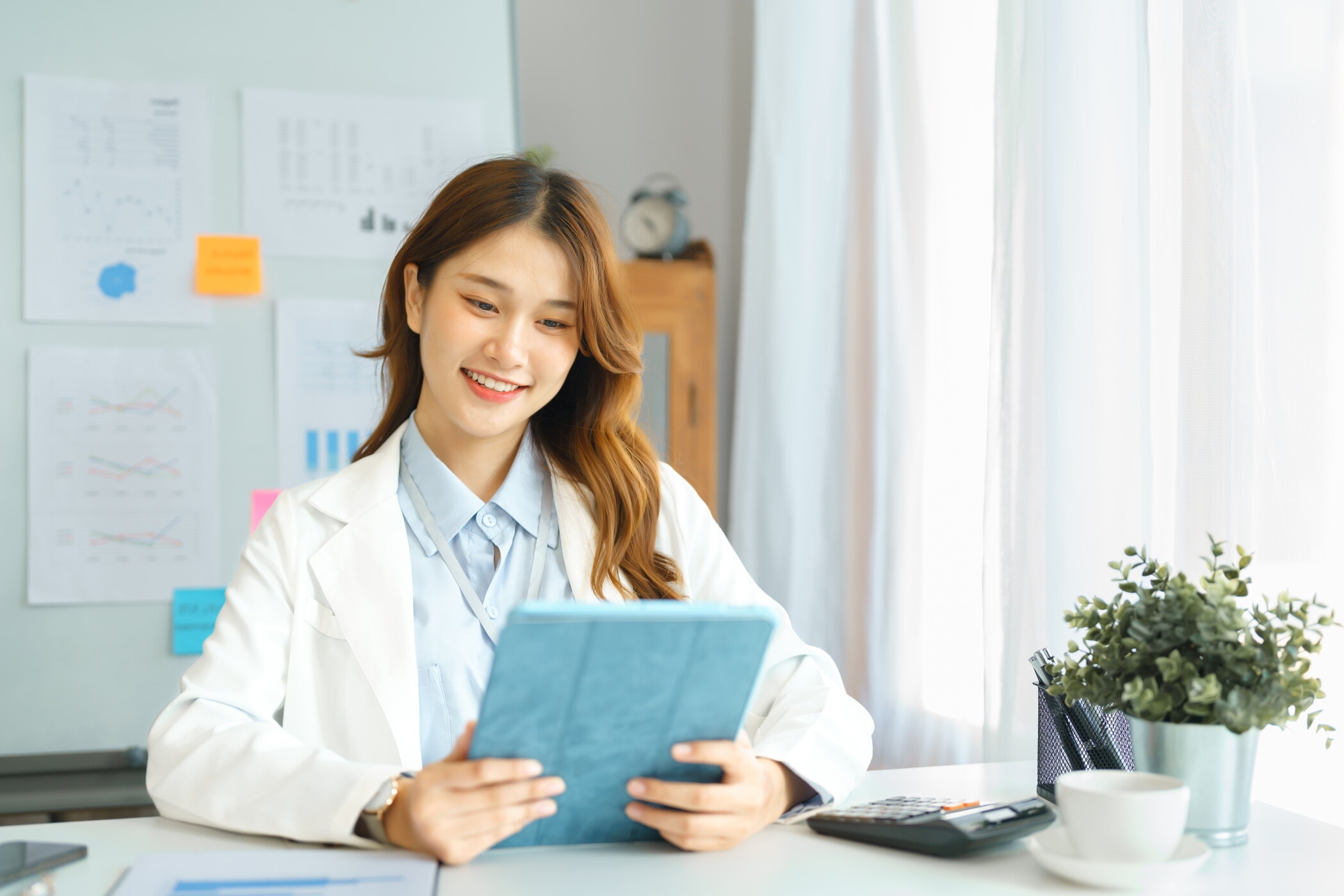 Businesswoman hold tablet to reading financial report