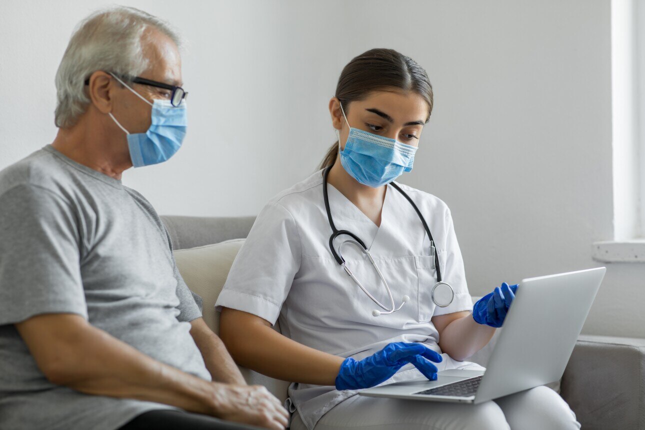 Healthcare worker at-home visit with patient