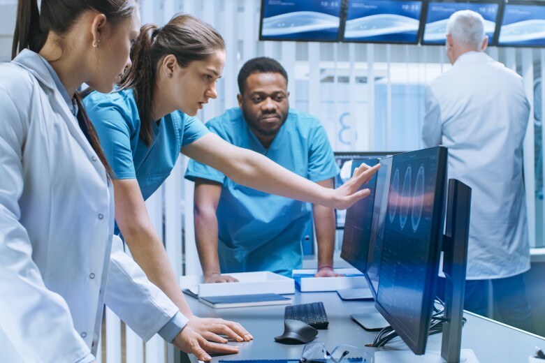 Team of Doctors reviewing Data